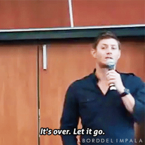 A Man Speaking Into A Microphone With The Words It 'S Over Let It Go GIF