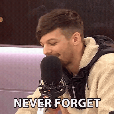 A Man Speaking Into A Microphone With The Words " Never Forget " Written Below Him GIF