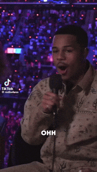 A Man Speaking Into A Microphone With The Words That 'S That On The Bottom GIF