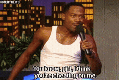 A Man Speaking Into A Microphone With The Words You Know Girl I Think You 'Re Cheating On Me Below Him GIF
