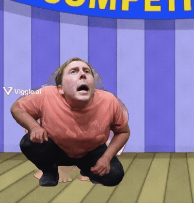 A Man Squatting In Front Of A Blue Sign That Says Competition GIF