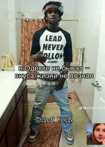 A Man Standing In A Bathroom Wearing A Lead Never Follow Shirt GIF