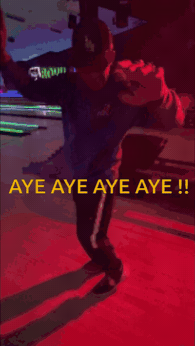 A Man Standing In A Bowling Alley With The Words Aye Aye Aye Aye GIF