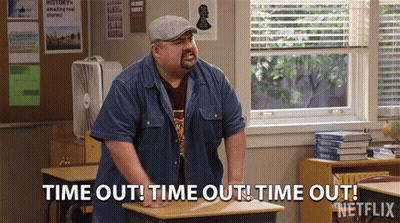 A Man Standing In A Classroom Says Time Out GIF