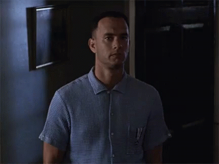 A Man Standing In A Dark Room With The Words I 'M Not A Smart Man GIF