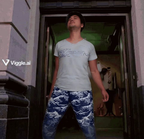 A Man Standing In A Doorway Wearing A Shirt That Says Viggle Ai GIF
