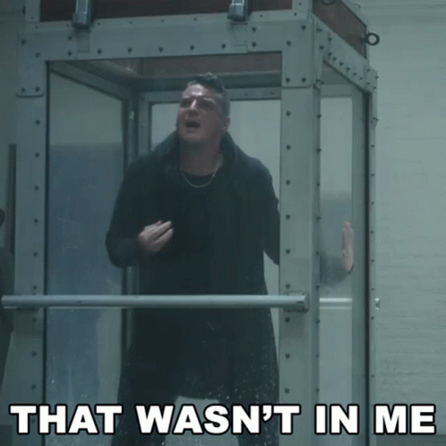 A Man Standing In A Glass Box With The Words That Wasn 'T In Me Above Him GIF