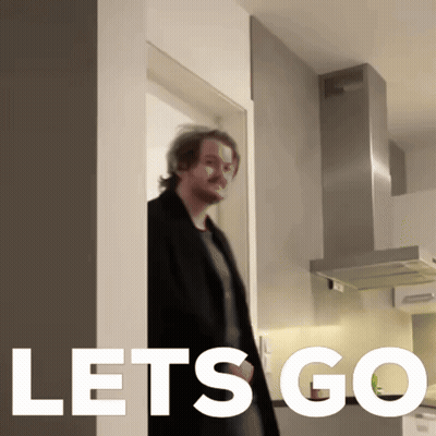 A Man Standing In A Kitchen With The Words Let 'S Go On The Bottom GIF