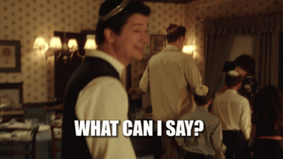 A Man Standing In A Room With The Words What Can I Say Written On The Bottom GIF