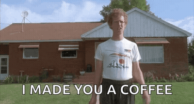 A Man Standing In Front Of A Brick House With The Words I Made You A Coffee GIF