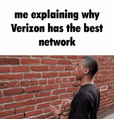 A Man Standing In Front Of A Brick Wall With A Caption That Says Me Explaining Why Verizon Has The Best Network GIF