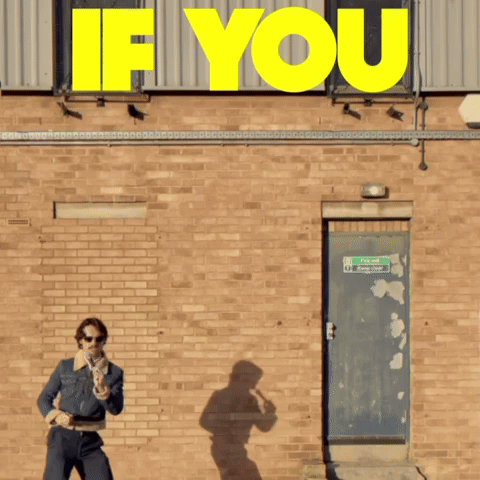 A Man Standing In Front Of A Brick Wall With A Sign That Says " If You " GIF
