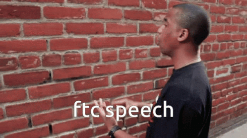 A Man Standing In Front Of A Brick Wall With The Words Ftc Speech Written On The Bottom GIF