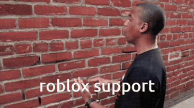 A Man Standing In Front Of A Brick Wall With The Words Roblox Support Written On The Bottom GIF