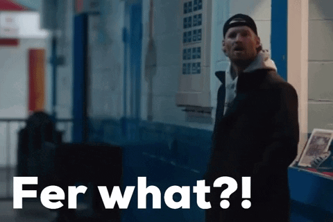 A Man Standing In Front Of A Building With Fer What Written On The Bottom GIF