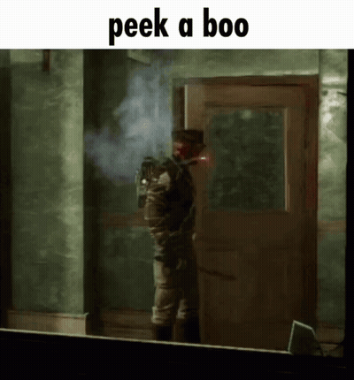 A Man Standing In Front Of A Door With The Words Peek A Boo On The Bottom GIF