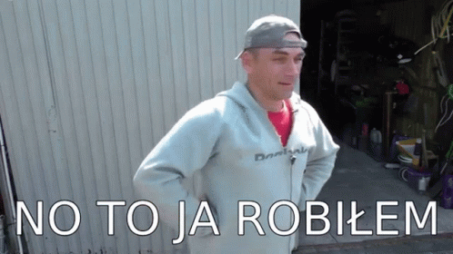 A Man Standing In Front Of A Garage With The Words " No To Ja Robilem " Written On The Bottom GIF