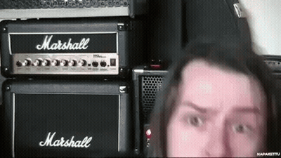 A Man Standing In Front Of A Marshall Amp GIF