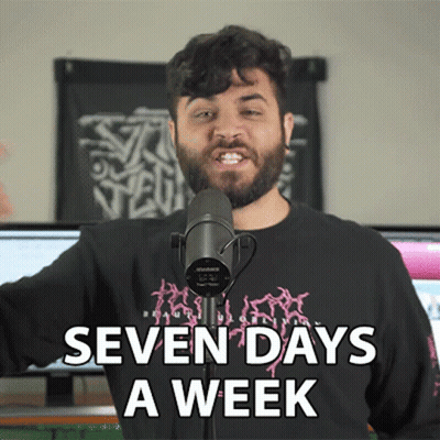 A Man Standing In Front Of A Microphone With The Words Seven Days A Week Written Below Him GIF