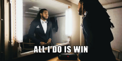 A Man Standing In Front Of A Mirror With The Words All I Do Is Win GIF