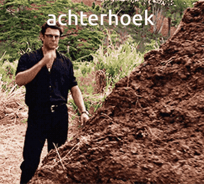A Man Standing In Front Of A Pile Of Dirt With The Word Achterhoek Written On It GIF