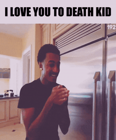 A Man Standing In Front Of A Refrigerator With The Words " I Love You To Death Kid " Above Him GIF
