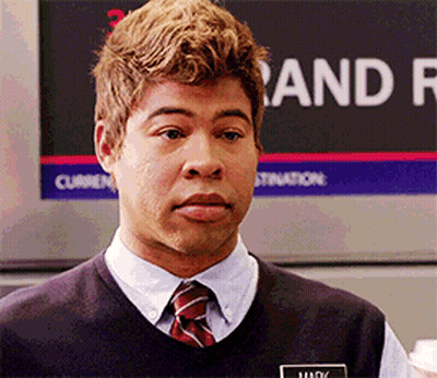 A Man Standing In Front Of A Sign That Says " And " GIF