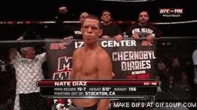 A Man Standing In Front Of A Sign That Says Center GIF