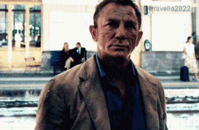 A Man Standing In Front Of A Sign That Says Eravello 2022 GIF