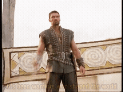 A Man Standing In Front Of A Sign That Says It 'S Been Warriors Who Shaped The World On It GIF