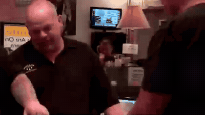A Man Standing In Front Of A Sign That Says No 911 On It GIF