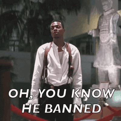 A Man Standing In Front Of A Statue With The Words Oh You Know He Banned On The Bottom GIF