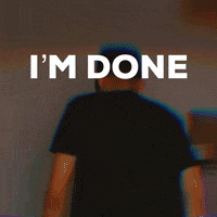 A Man Standing In Front Of A Wall With The Words I 'M Done Written On It GIF