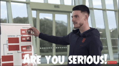 A Man Standing In Front Of A White Board That Says Are You Serious GIF