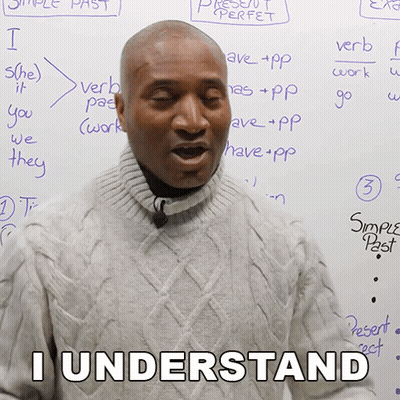 A Man Standing In Front Of A White Board With The Words I Understand Written On It GIF