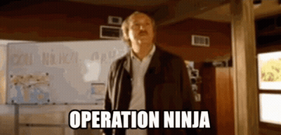 A Man Standing In Front Of A White Board With The Words Operation Ninja On It GIF