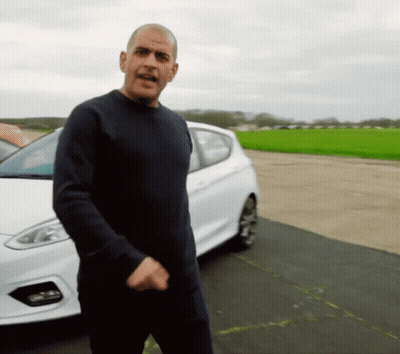 A Man Standing In Front Of A White Car GIF