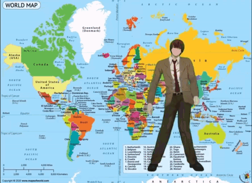 A Man Standing In Front Of A World Map GIF