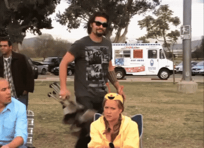 A Man Standing In Front Of An Ice Cream Truck That Says ' Coral ' On The Side GIF