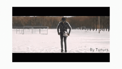 A Man Standing In The Snow With The Words By Tunurs On The Bottom Right GIF
