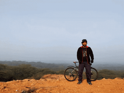A Man Standing Next To A Bike Wearing A Shirt That Says ' I Love Cycling ' On It GIF