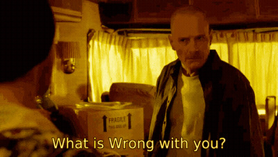 A Man Standing Next To A Box That Says " Fragile " On It GIF