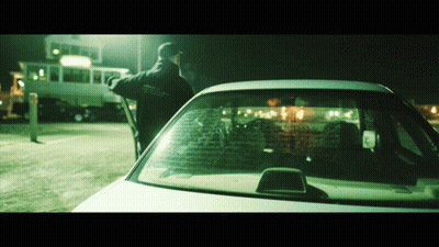 A Man Standing Next To A Car That Has A Sticker On The Windshield That Says ' Ambulance ' GIF