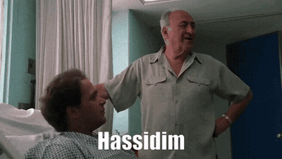 a man standing next to a man in a hospital bed with the word hassidium written on the bottom