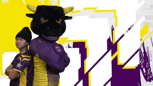 A Man Standing Next To A Mascot Wearing A Purple And Yellow Shirt That Says Esg On It GIF