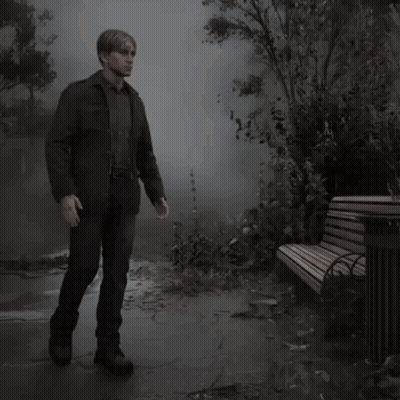 A Man Standing Next To A Park Bench In The Fog GIF