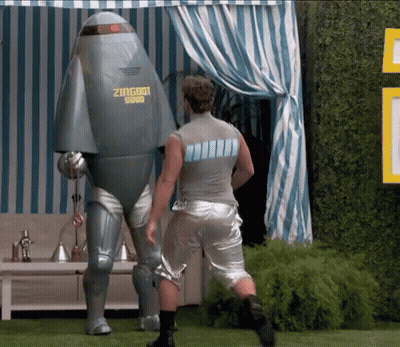 A Man Standing Next To A Robot That Says Zingbot GIF