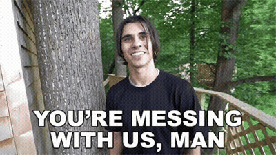 A Man Standing Next To A Tree With The Words " You 'Re Messing With Us , Man " On The Bottom GIF
