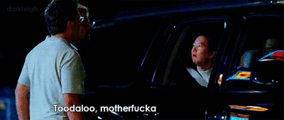 A Man Standing Next To Another Man In A Car With The Words Toodaloo Motherfucka Written On The Screen GIF