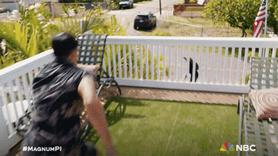 A Man Standing On A Balcony With The Nbc Logo On The Bottom Right GIF